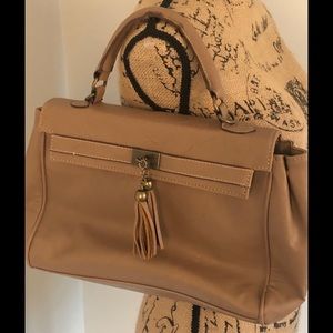 Light brown handbag with tassels